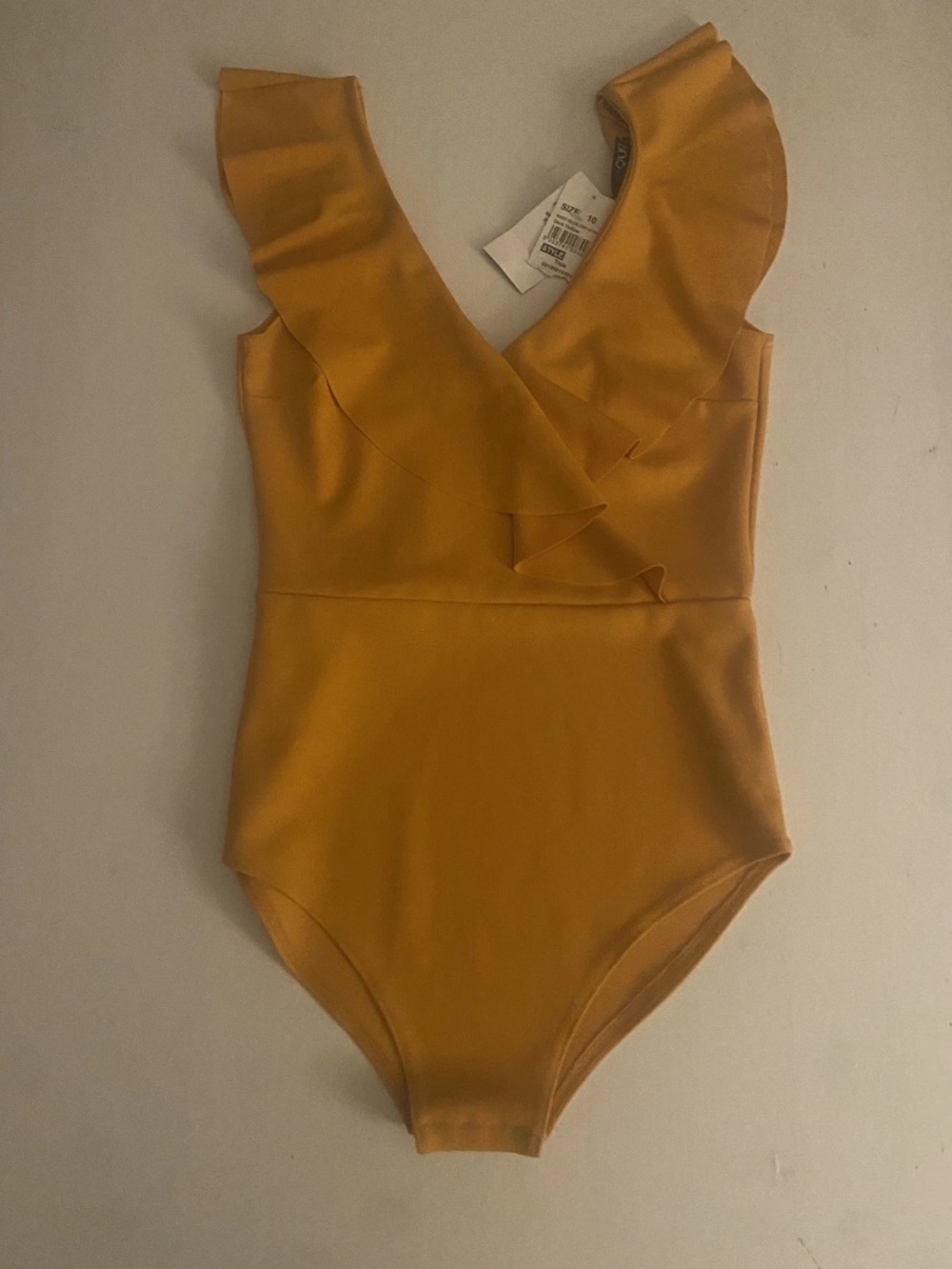 Quiz Brand made in the UK- Sleeveless, Ruffled VNeck bodysuit Size 10 NWT